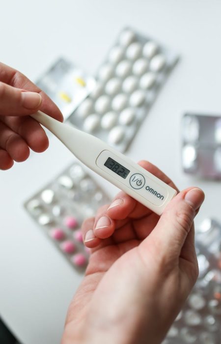 photo-of-person-holding-digital-thermometer-3873159